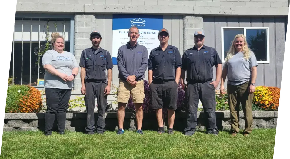 Five Arvu team members in casual clothing stand in a row outside a building with the "ARVU AUTO" logo
