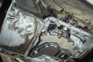 Slipping transmission, auto repair in Long Lake, MN, at Arvu Auto. Image of an automatic transmission with the transmission pan removed during transmission service, exposing the valve body and internal components for inspection, maintenance, and repair.