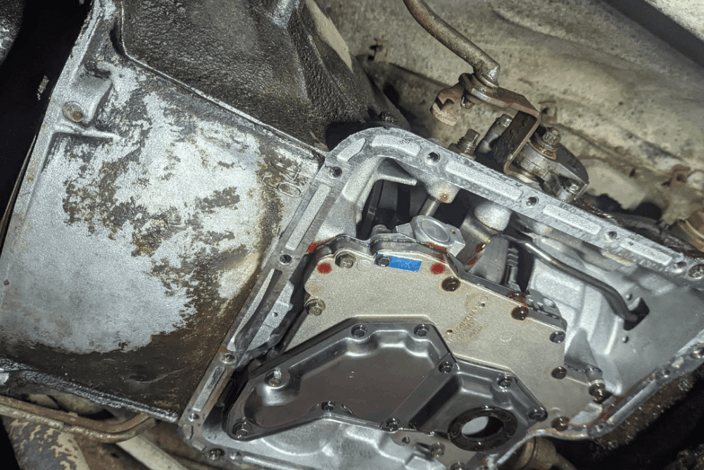 Slipping transmission, auto repair in Long Lake, MN, at Arvu Auto. Image of an automatic transmission with the transmission pan removed during transmission service, exposing the valve body and internal components for inspection, maintenance, and repair.