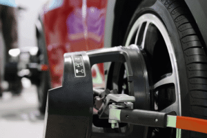 Tires and alignment, auto repair in Watertown, MN. Image of used engine oil draining from a vehicle into a collection pan during routine maintenance to help protect engine performance, reliability, and long-term vehicle health.