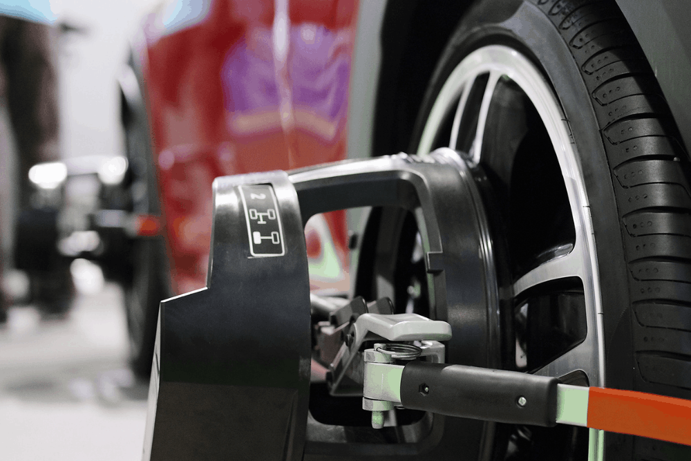 Tires and alignment, auto repair in Watertown, MN. Image of used engine oil draining from a vehicle into a collection pan during routine maintenance to help protect engine performance, reliability, and long-term vehicle health.